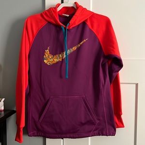 Nike therma-fit hoodie in plum and red. Colorful swoosh and teal hoodie …